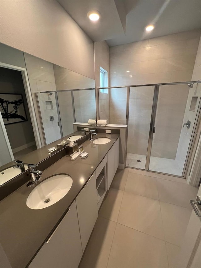 bathroom featuring vanity, tile patterned floors, and an enclosed shower