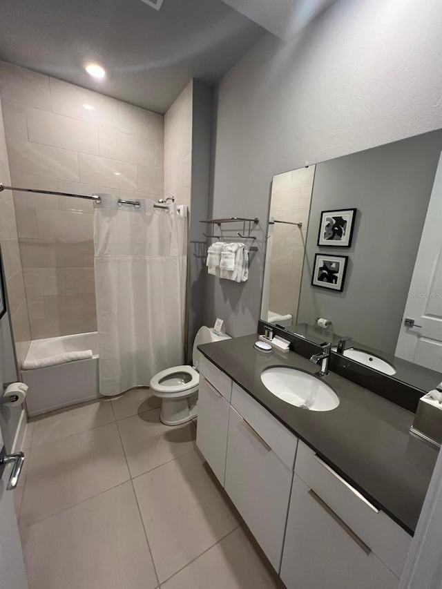 full bathroom featuring toilet, vanity, shower / tub combo, and tile patterned flooring