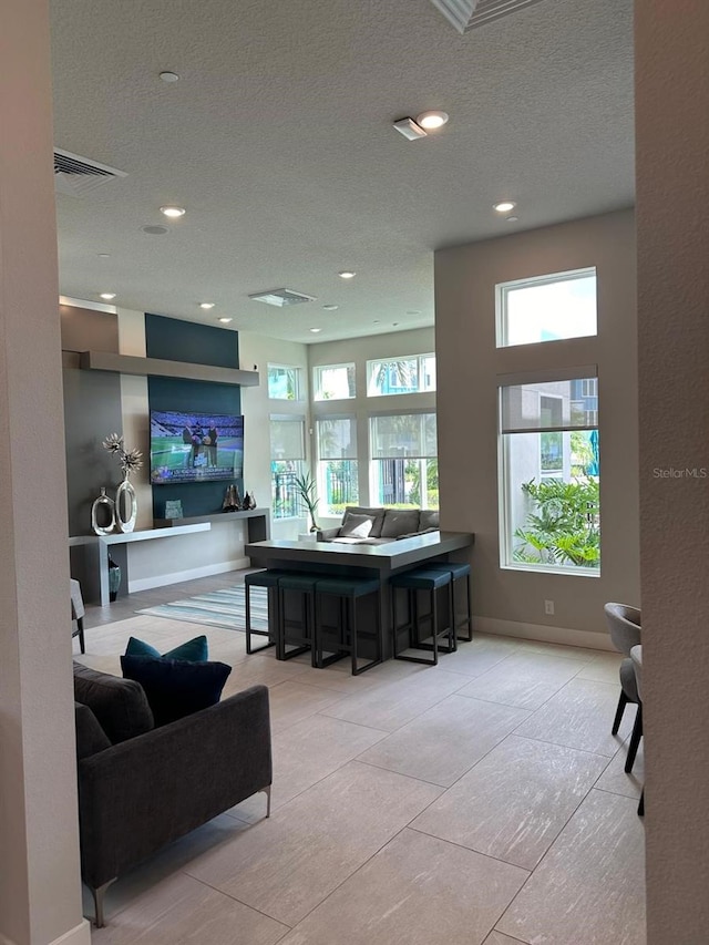 interior space with a textured ceiling