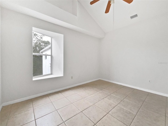 tiled empty room featuring ceiling fan and high vaulted ceiling