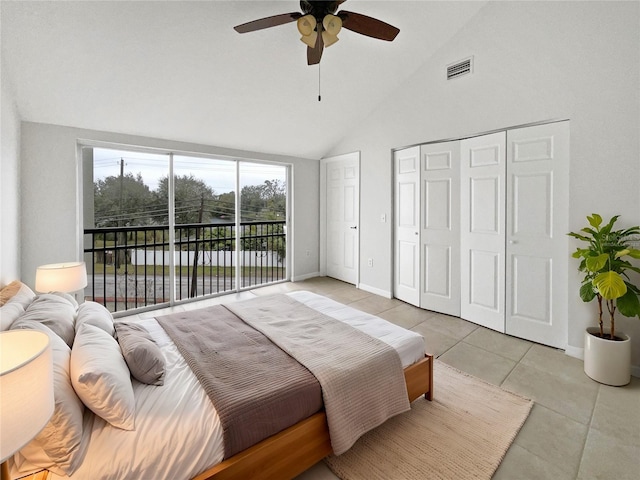 tiled bedroom with high vaulted ceiling, access to outside, ceiling fan, and a closet