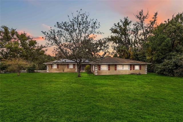 view of front of property with a yard