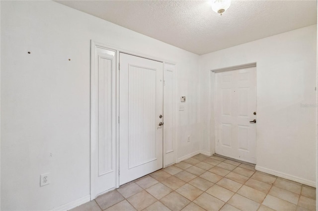 entrance foyer with a textured ceiling