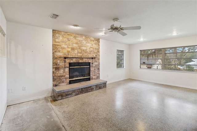 unfurnished living room featuring ceiling fan and a fireplace