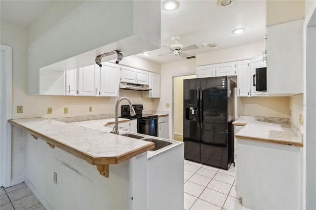 kitchen featuring ceiling fan, white cabinetry, black appliances, light tile patterned flooring, and kitchen peninsula