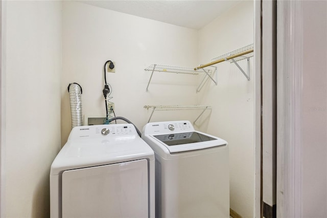 laundry room with washer and clothes dryer