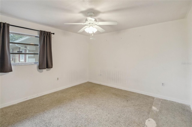 unfurnished room with ceiling fan and carpet floors