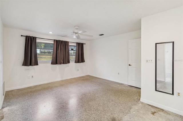 spare room with ceiling fan