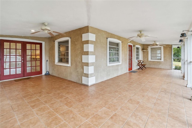 view of patio with french doors and ceiling fan