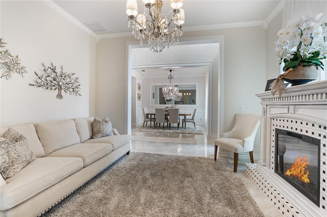 living room with an inviting chandelier, crown molding, and a fireplace