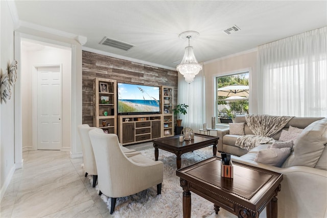 living room with ornamental molding and a chandelier