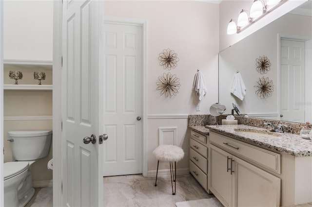 bathroom with vanity and toilet