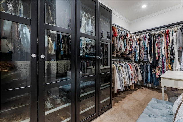 walk in closet featuring french doors and carpet floors