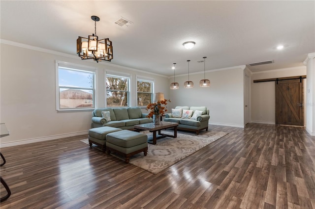 living room featuring crown molding, dark wood-type flooring, and a barn door