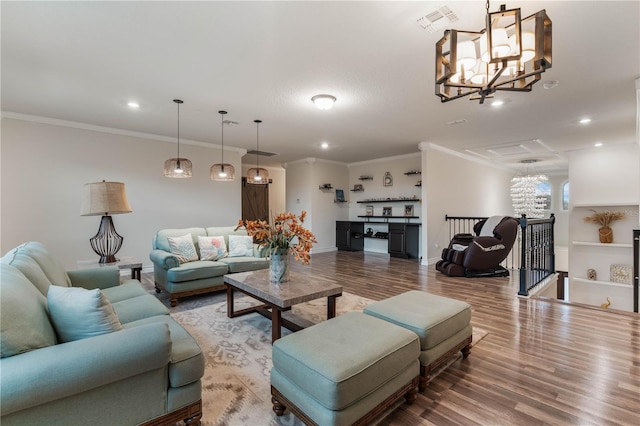 living room with crown molding, wood-type flooring, and a chandelier