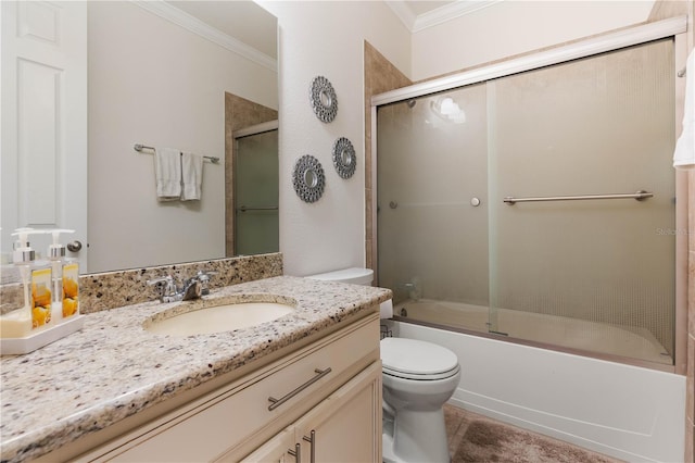 full bathroom featuring vanity, ornamental molding, toilet, and combined bath / shower with glass door