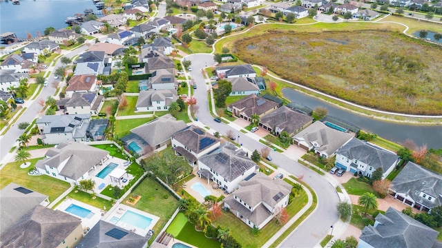 birds eye view of property featuring a water view