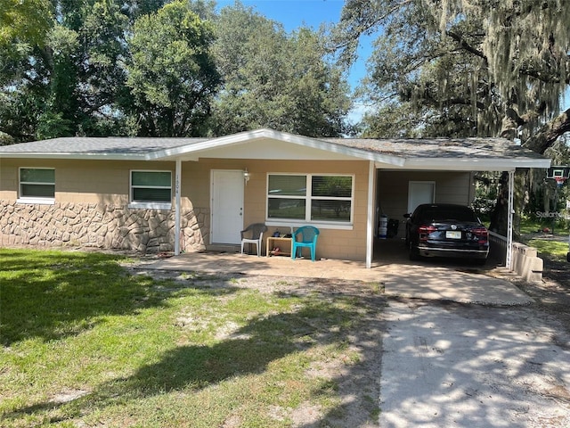 ranch-style house with a front lawn and a carport