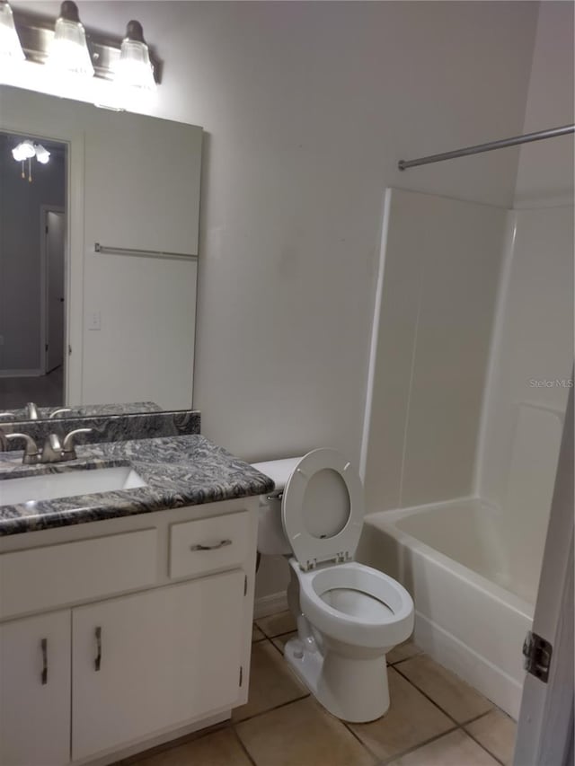 full bathroom with tile patterned flooring, shower / tub combination, vanity, and toilet