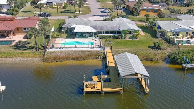 birds eye view of property with a water view