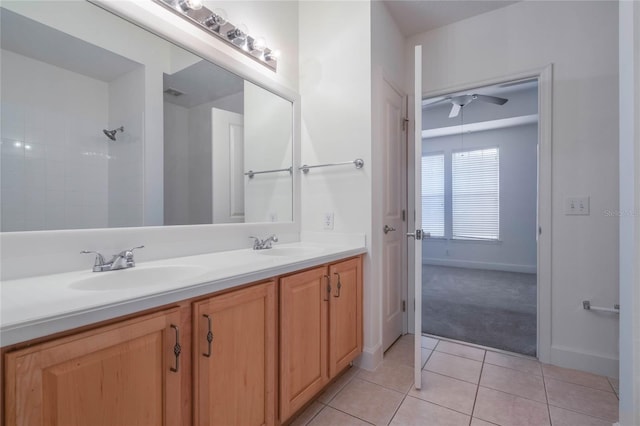 bathroom featuring tile patterned flooring, vanity, and ceiling fan