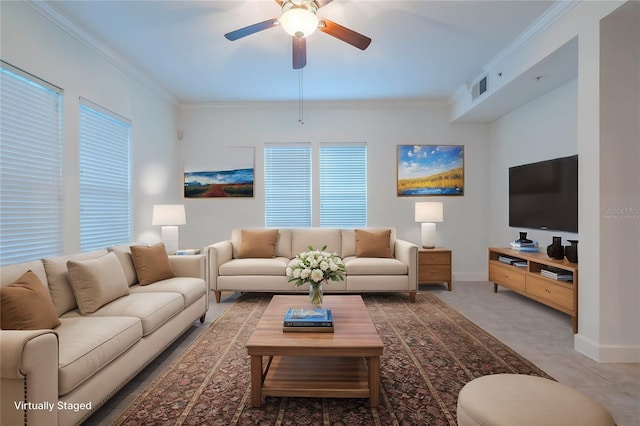 living room with ceiling fan and ornamental molding