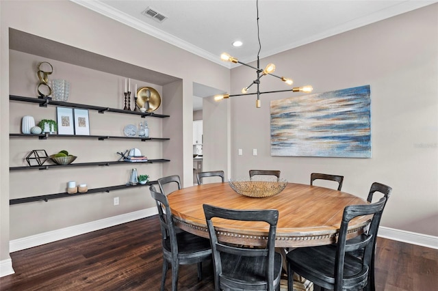 dining area featuring dark hardwood / wood-style floors and ornamental molding