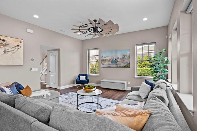 living room with ceiling fan and dark hardwood / wood-style floors