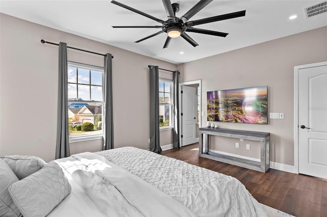 bedroom featuring ceiling fan and dark hardwood / wood-style floors