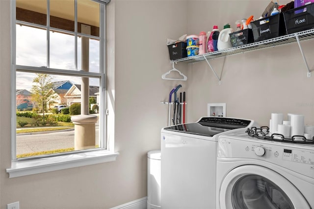 laundry room with washing machine and clothes dryer