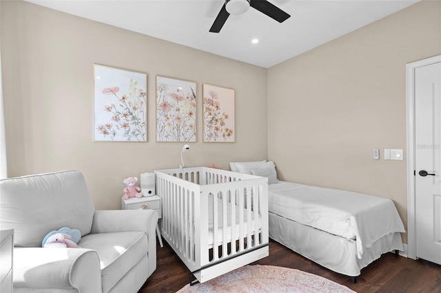 bedroom featuring ceiling fan and dark hardwood / wood-style floors