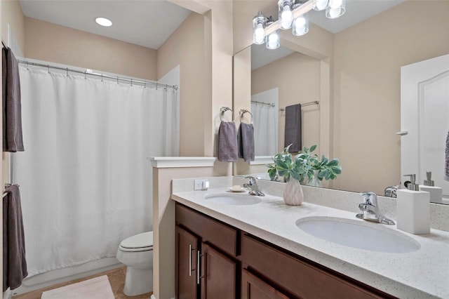 bathroom with toilet and vanity