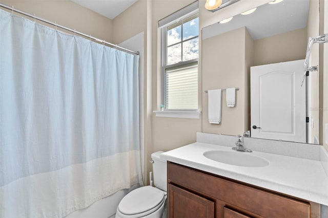 full bathroom with vanity, toilet, and shower / bath combo