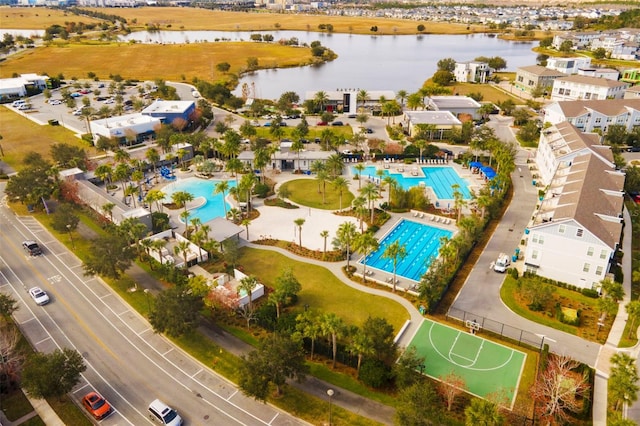 birds eye view of property with a water view