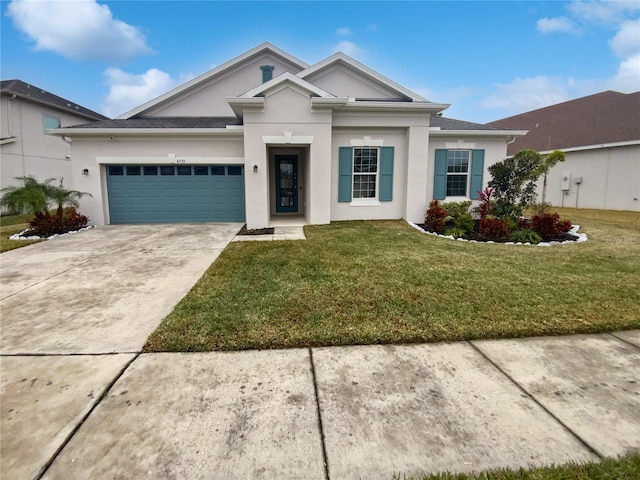 ranch-style house with a garage and a front lawn