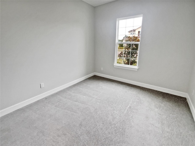 unfurnished room featuring carpet floors