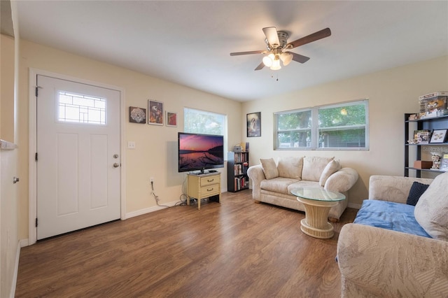 living room featuring hardwood / wood-style floors, a wealth of natural light, and ceiling fan