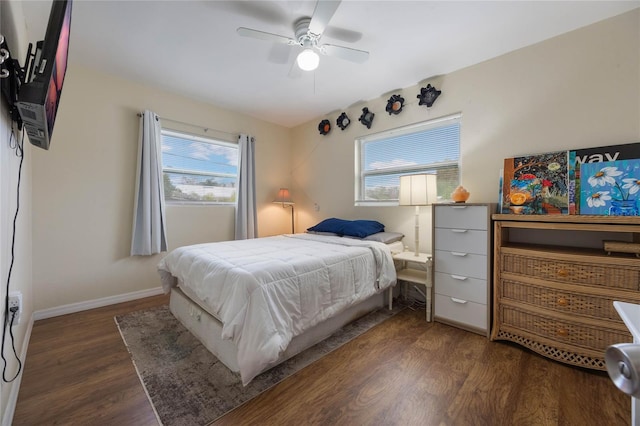 bedroom with ceiling fan and dark hardwood / wood-style flooring