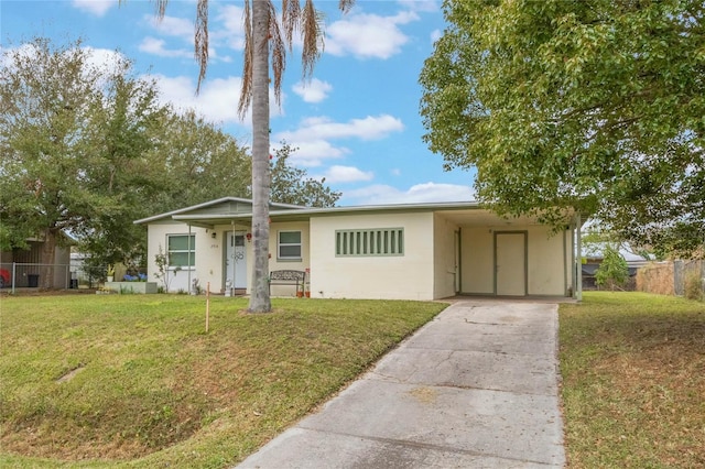 ranch-style house with a carport and a front yard