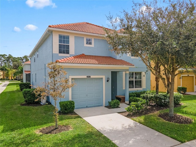 mediterranean / spanish-style house featuring a garage and a front yard