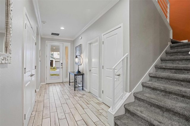 entryway with crown molding