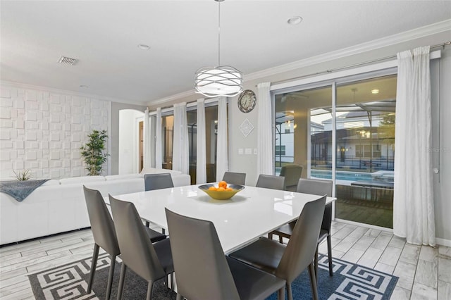 dining room featuring ornamental molding