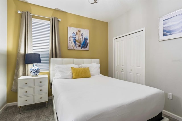 bedroom featuring dark carpet and a closet