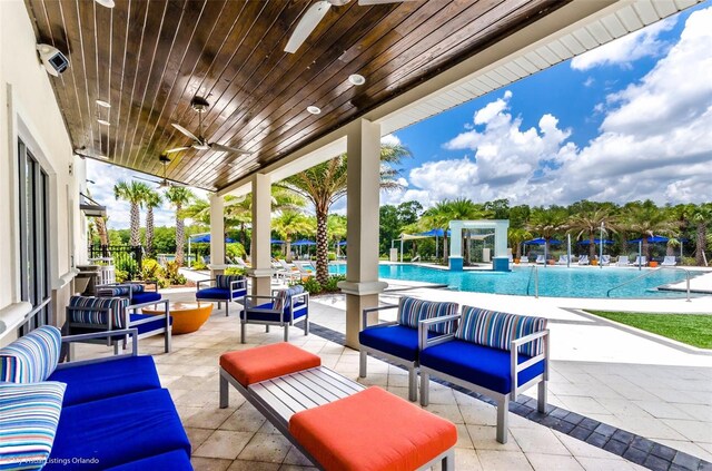 2628 Calistoga Ave, Kissimmee, FL 34741 - view of patio featuring an outdoor living space, a community pool, and a ceiling fan