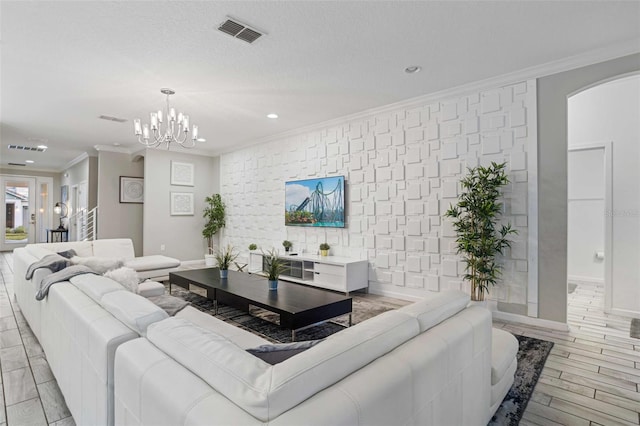 2628 Calistoga Ave, Kissimmee, FL 34741 - living area featuring arched walkways, recessed lighting, crown molding, a chandelier, and baseboards