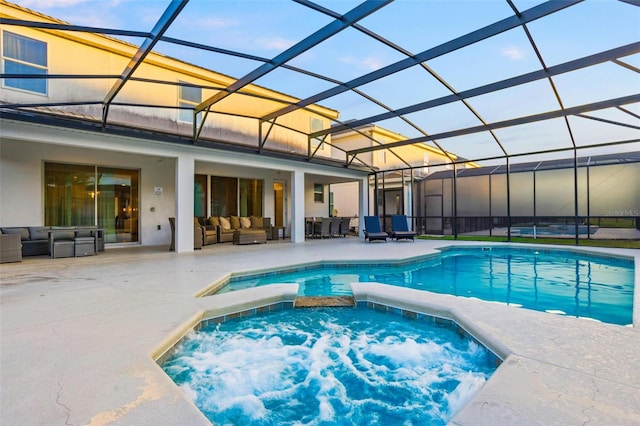 2628 Calistoga Ave, Kissimmee, FL 34741 - view of pool featuring an outdoor living space, a patio area, a pool with connected hot tub, and a lanai