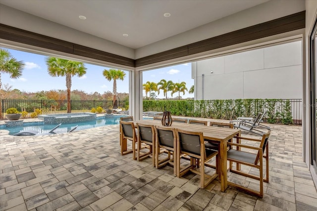 exterior space with a bar and an in ground hot tub