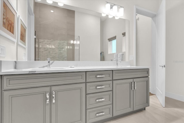 bathroom featuring vanity and an enclosed shower