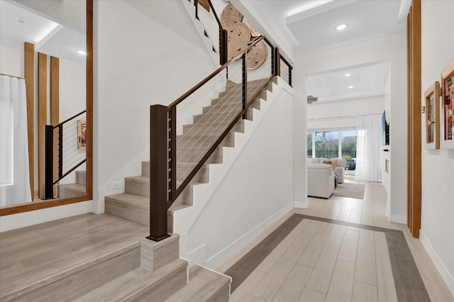 stairs featuring wood-type flooring