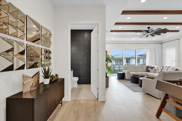 interior space with ceiling fan and light wood-type flooring